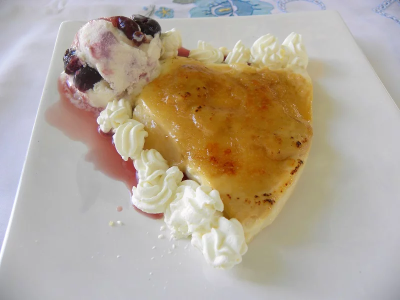 Baked caramelized rice pudding with ice cream image