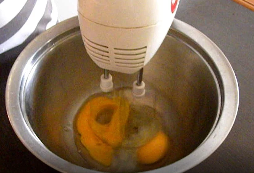 Beating eggs for avgolemono sauce image