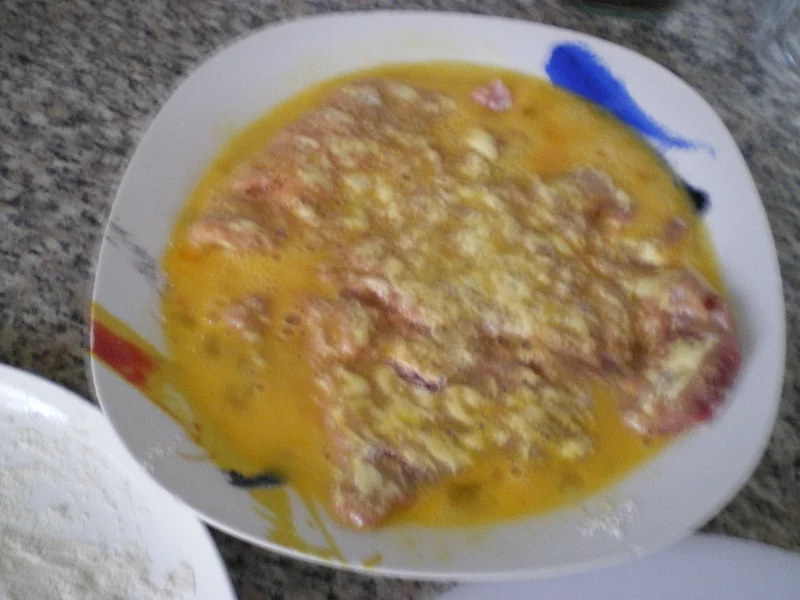 Dipping them in egg image