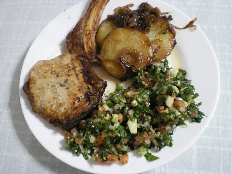 served-with-pork-chops Pork chop served with tambouli image