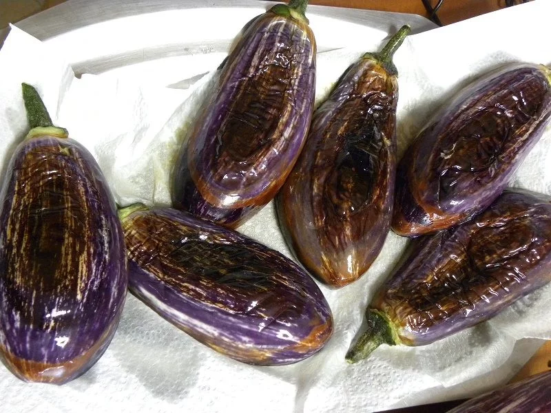 Eggplants fried and draining on kitchen paper image