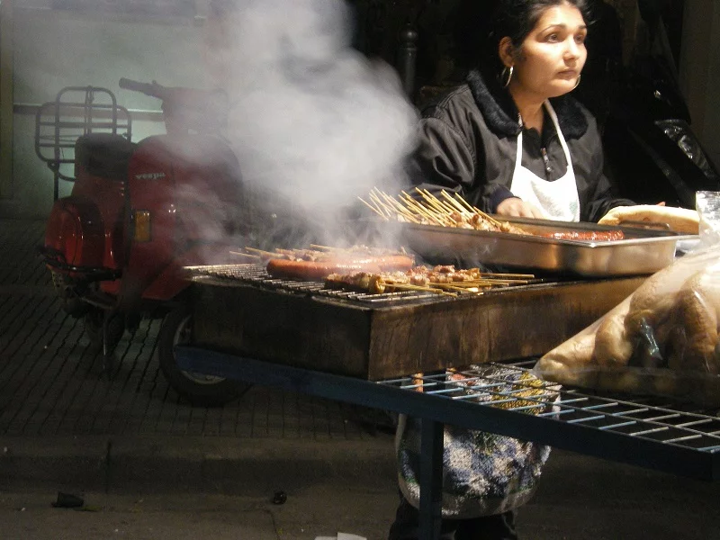 lady selling souvlakia on Tsiknopempti image