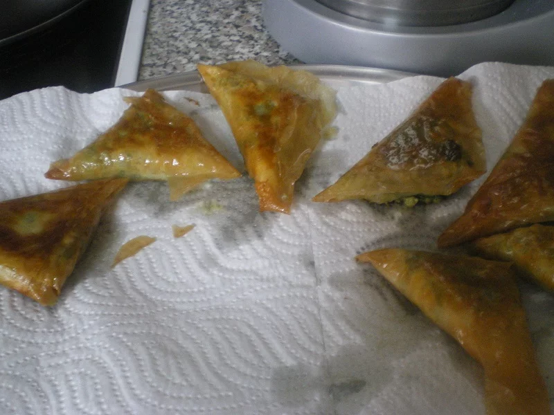 spanakopitakia on kitchen paper image