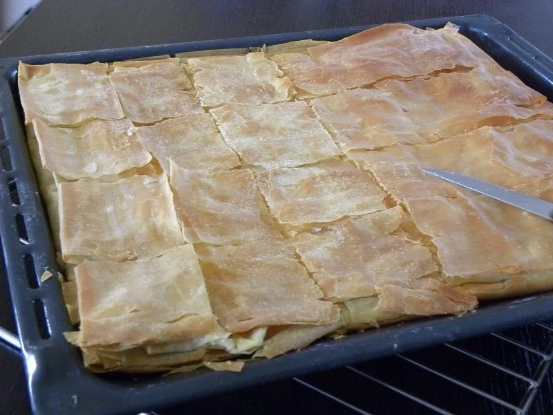 Homemade phyllo Tyropita in a large tray