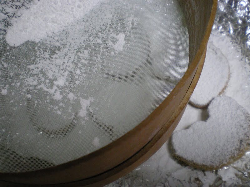 Sieving icing sugar image