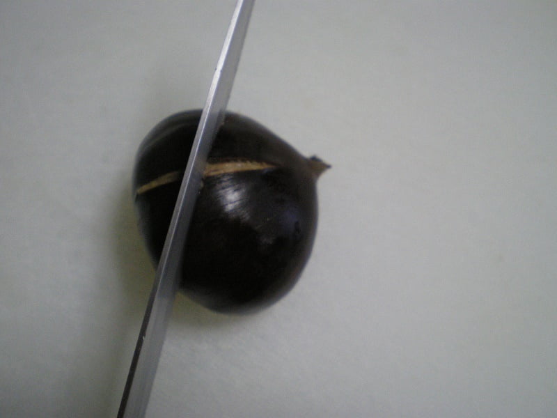 scoring chestnuts crosswise image