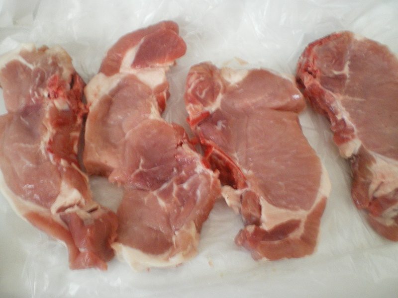 raw pork chops image