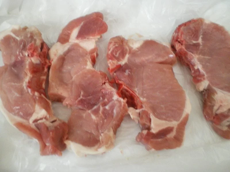 raw pork chops image