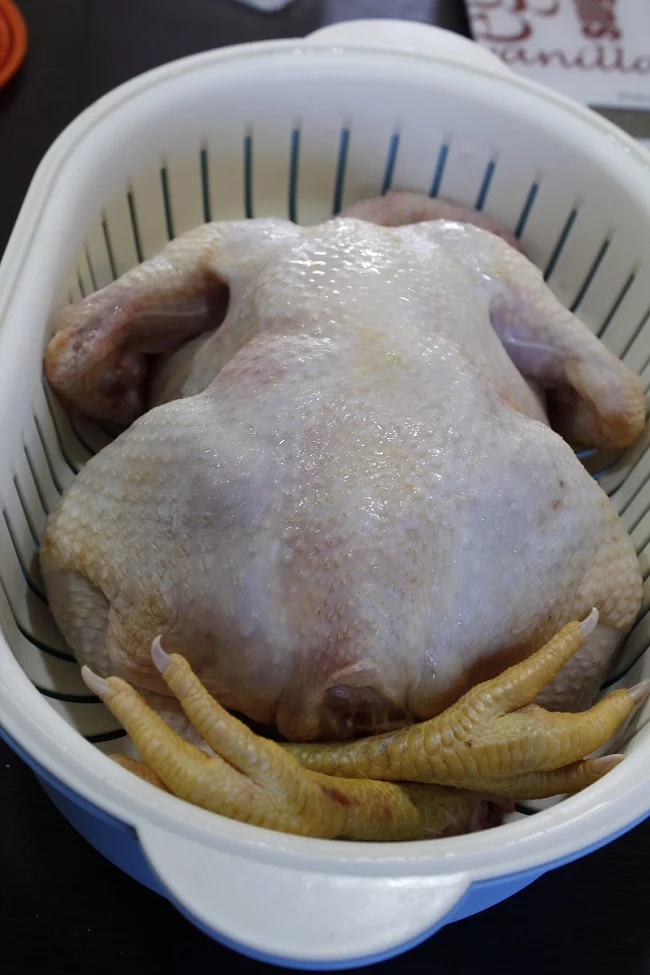 Whole rooster kokoras before cooking