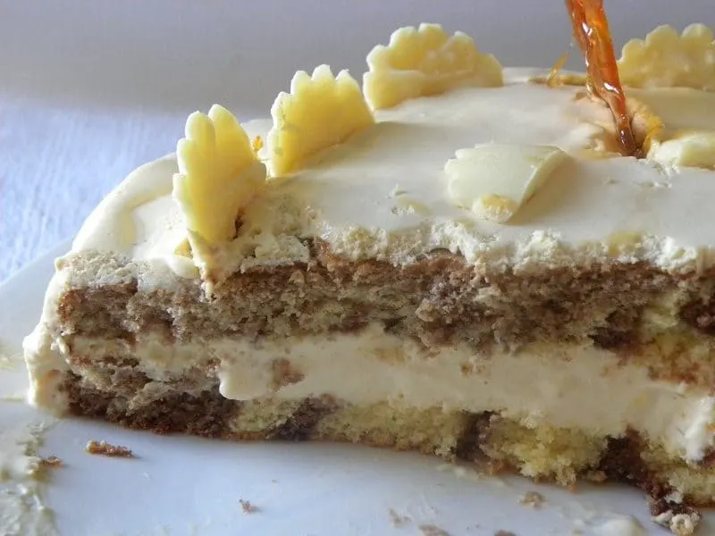 Stripes in cake and white chocolate on top image