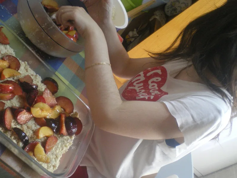 plumb crumble Elia helping to make the crumble image