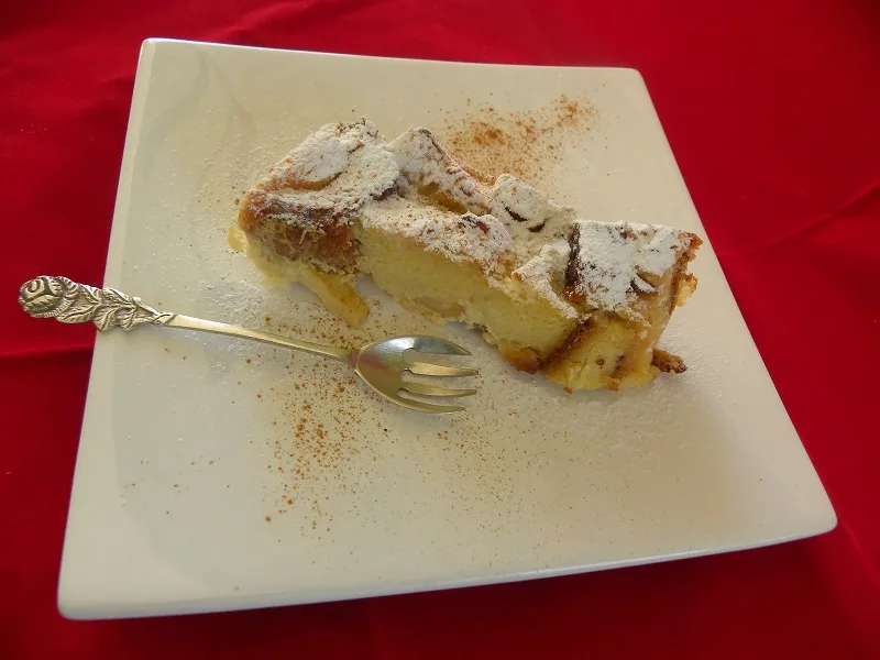 Tsoureki pudding with icing sugar A slice of Tsoureki pudding with icing sugar image