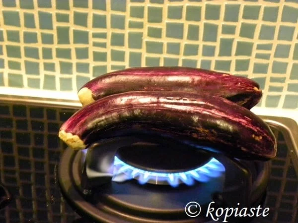 Charring eggplants image