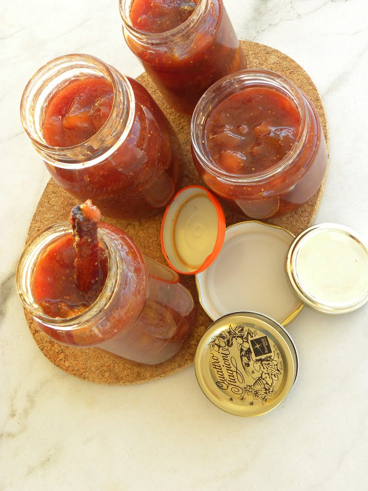 Banana, fig peach and grape jam in jars image