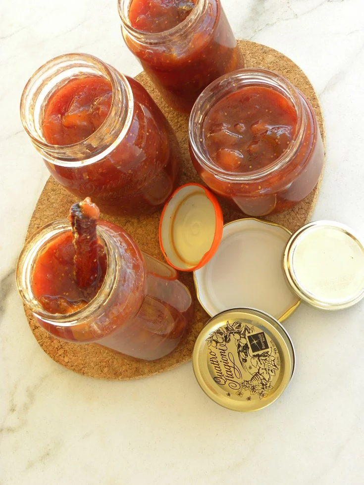 Banana, fig peach and grape jam in jars image