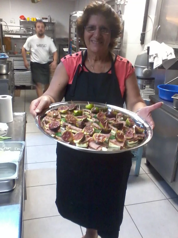 Ivy in the kitchen with a platter of halloumi and fig appetizer image