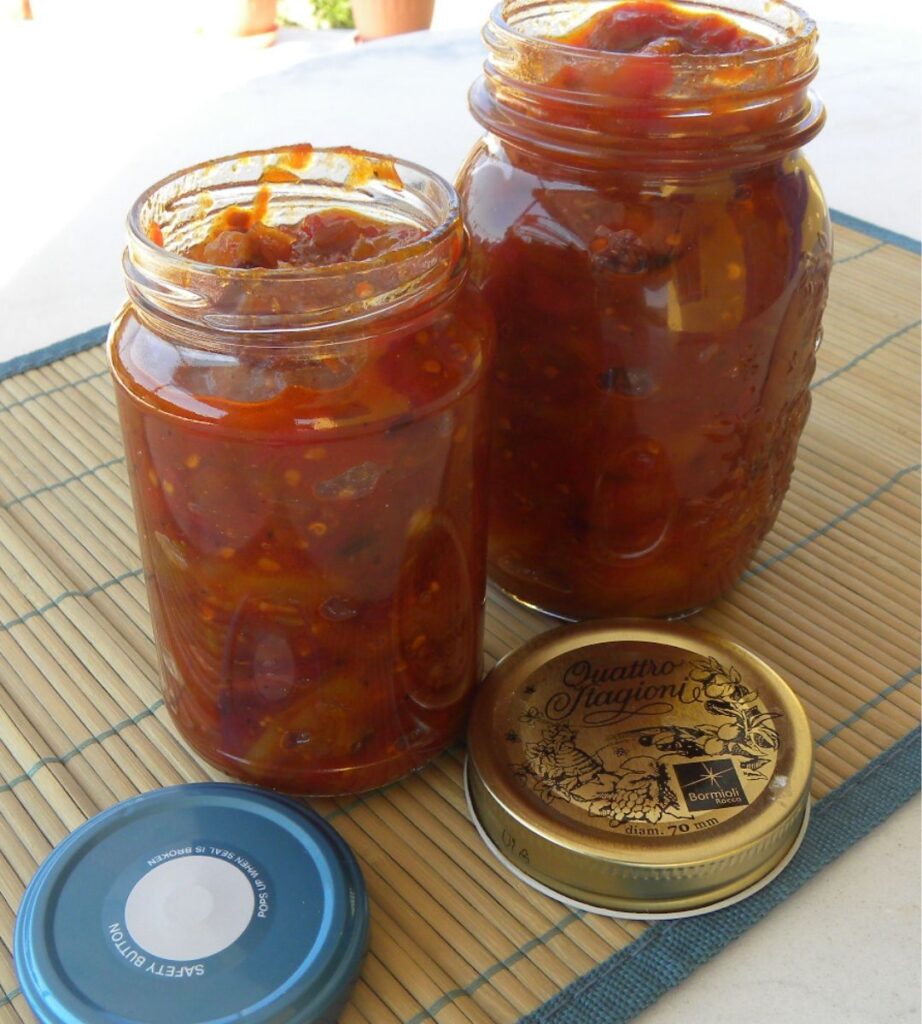 Jars of homemade tomato fruit chutney image
