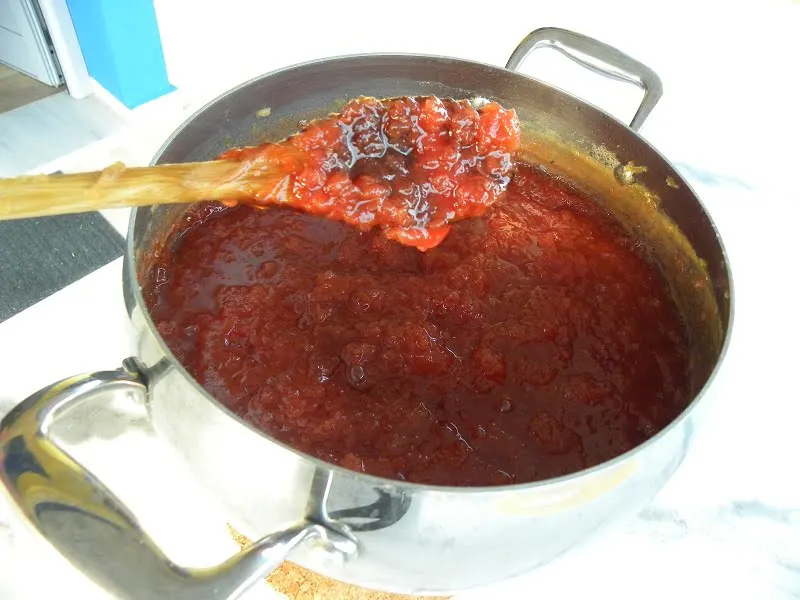 Syrup in quince jam before setting image