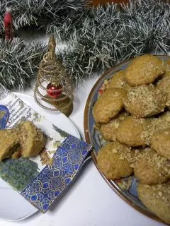 Melomakarona stuffed with white chocolate raspberry jam and walnuts image