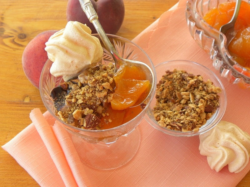 Peach compote with meringue and roasted nuts image