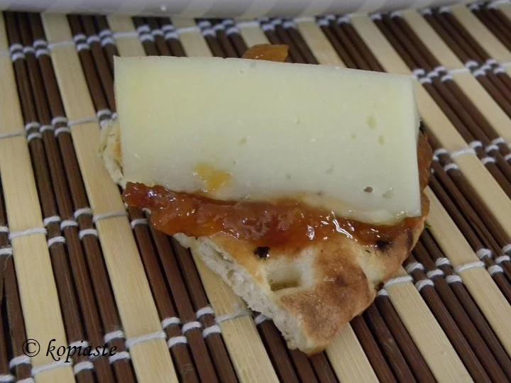 Pita chips with jam and graviera
