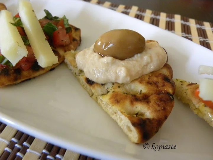 Pita chips with taramosalata and green olives