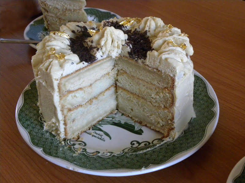 White chocolate mocha cake with gold leafs image
