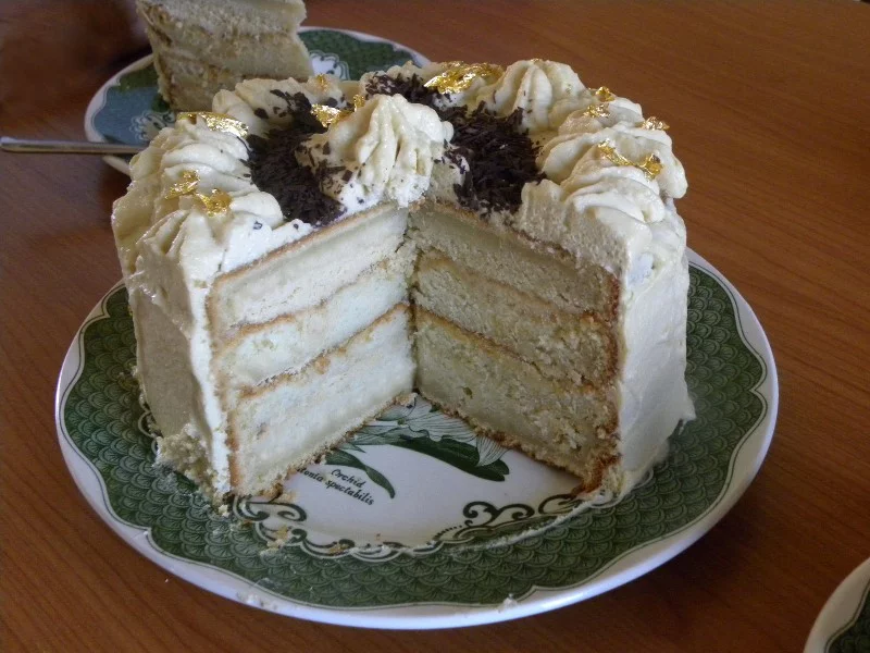 White chocolate mocha cake with gold leafs image