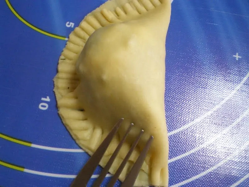 Other turnovers pressed with a fork image