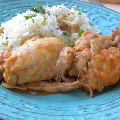 Kotopoulo kokkinisto stewed chicken and pilaf with omelet picture