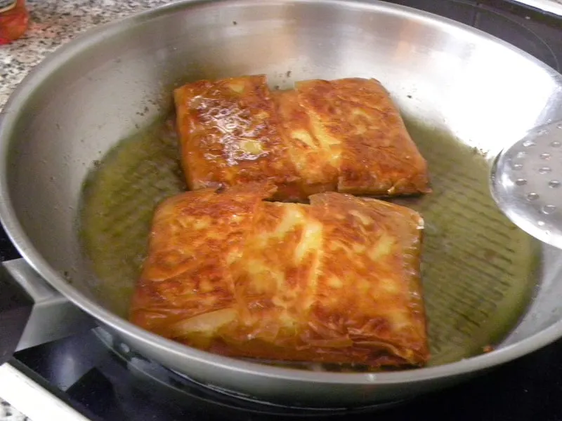 Frying crispy feta image