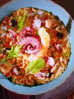 Octopus risotto in a plate image