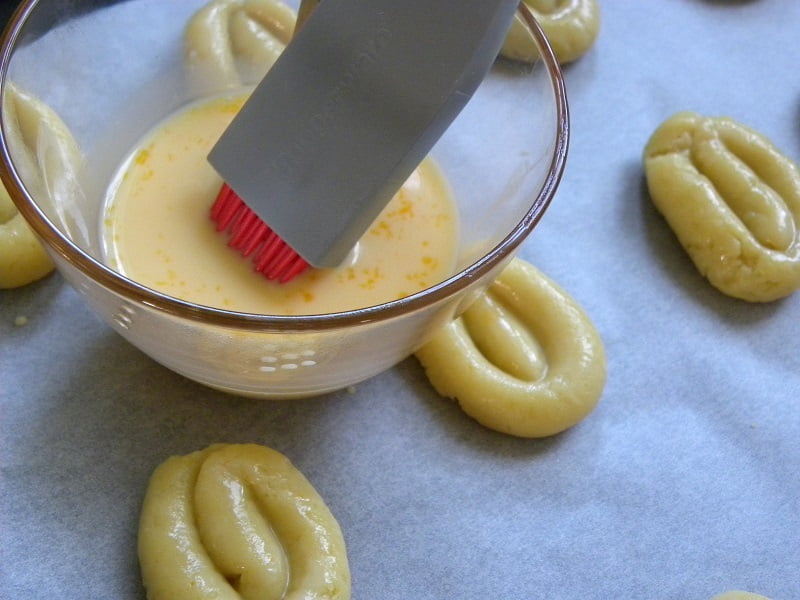 Brushing them with egg wash image