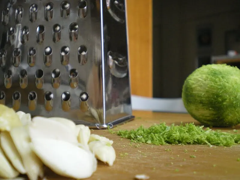 grated limes and blanched almonds image