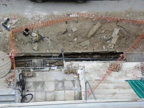 Workers trying to fix the damage image