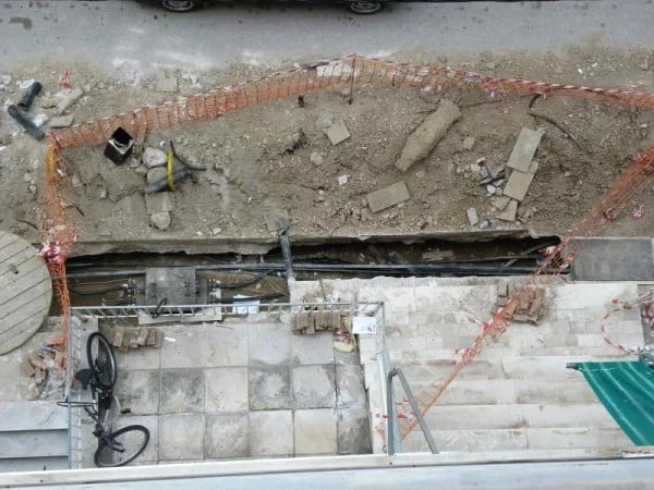 Workers trying to fix the damage image