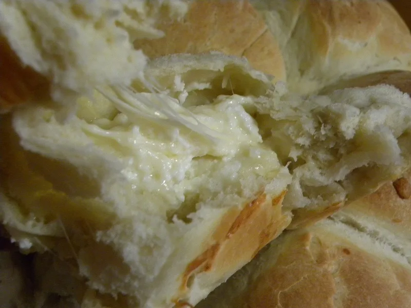 Cutting bread while hot image