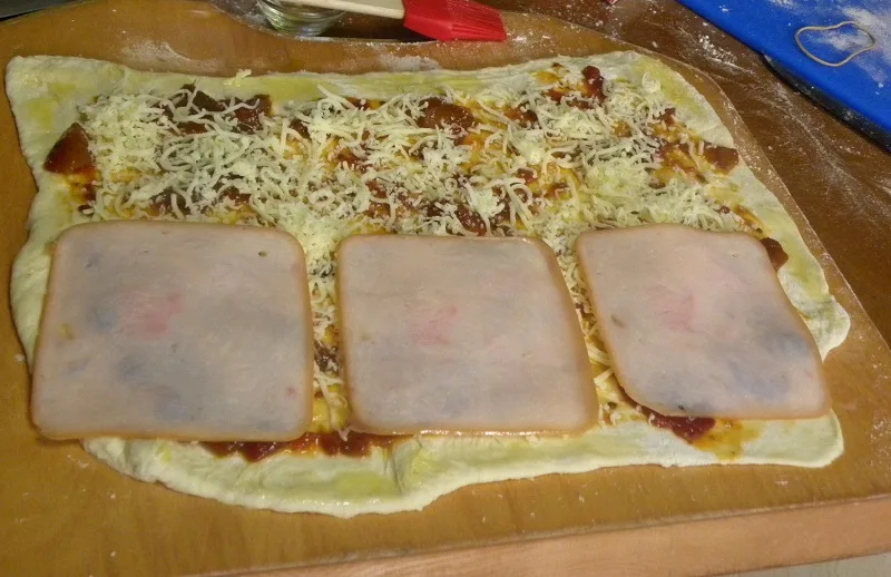 Pizza rolls before rolling image