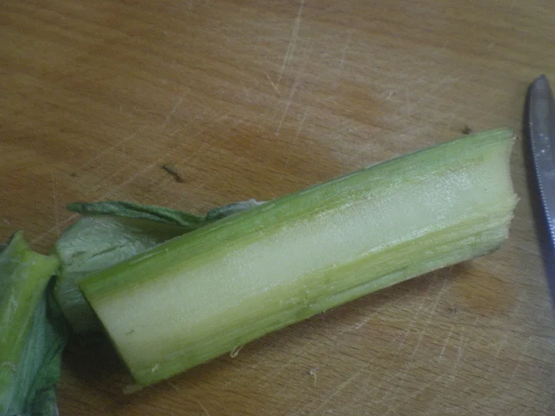 Peeling the stem of the artichoke image