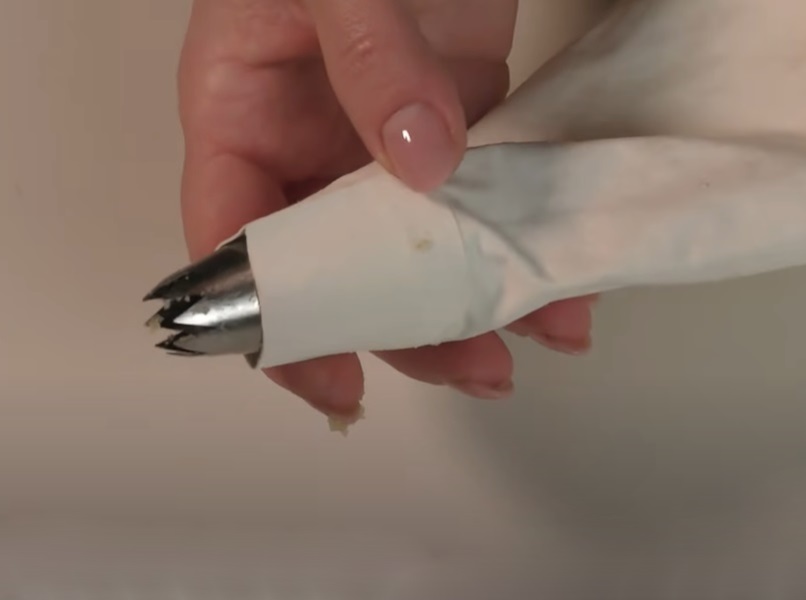 Piping bag with star shaped nozzle image