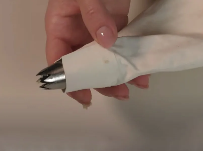 Piping bag with star shaped nozzle image