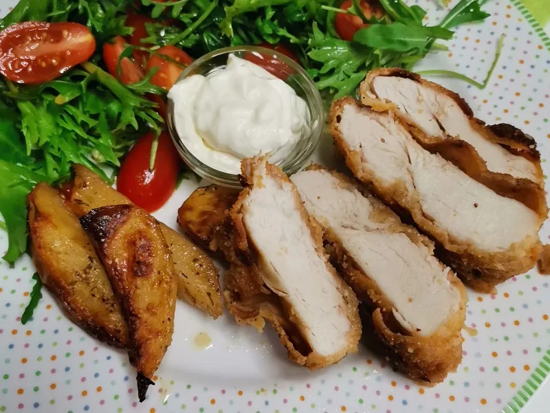Breaded chicken cut into slices image