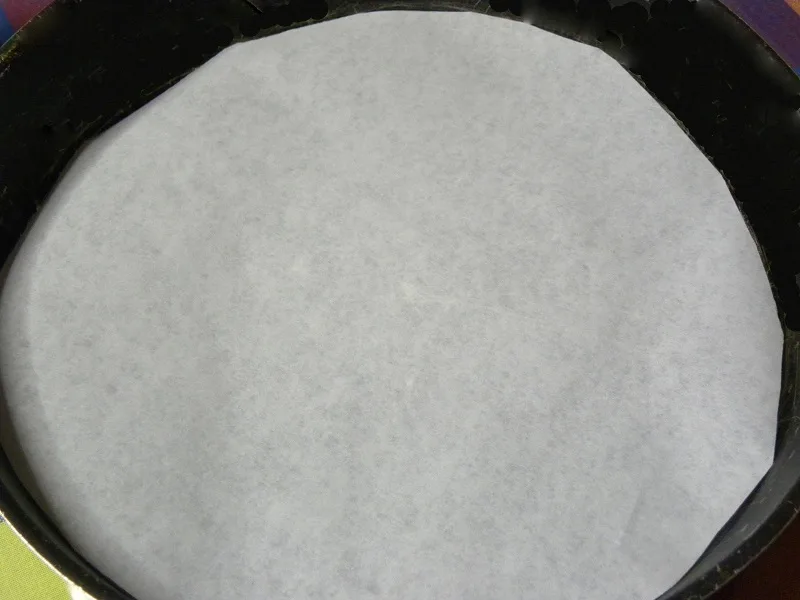 Baking tin lined with parchment paper image