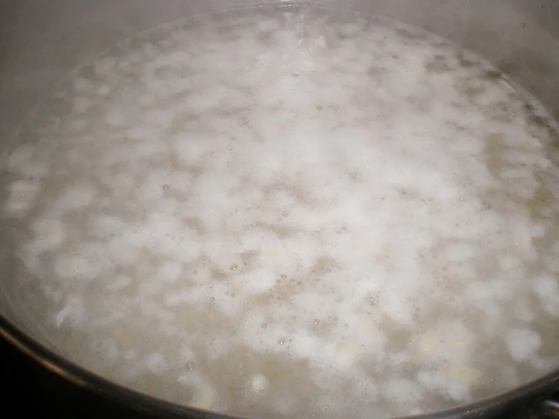 Skimming froth from the beans image