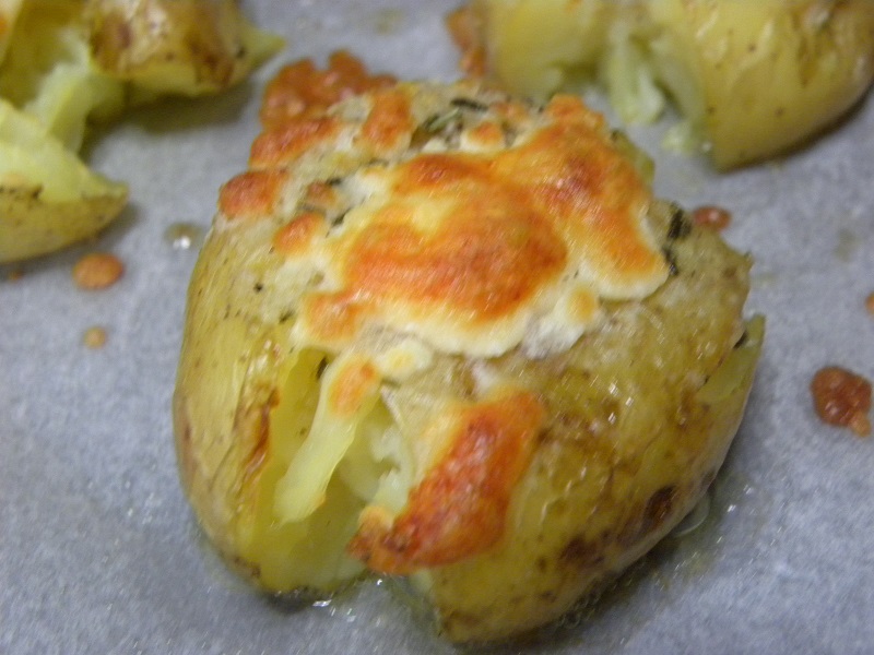 Potato smashed with cheese on top image