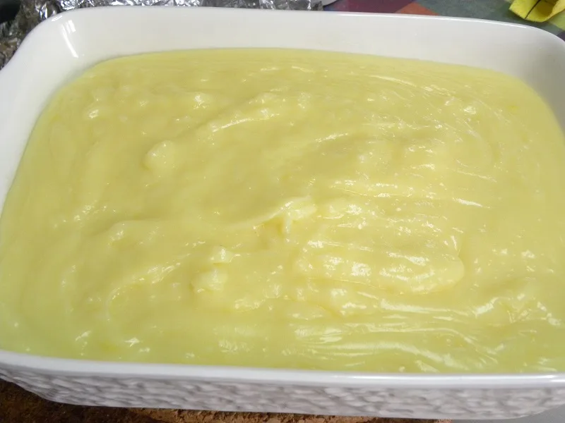 Putting the pastry cream on top of the tsoureki image