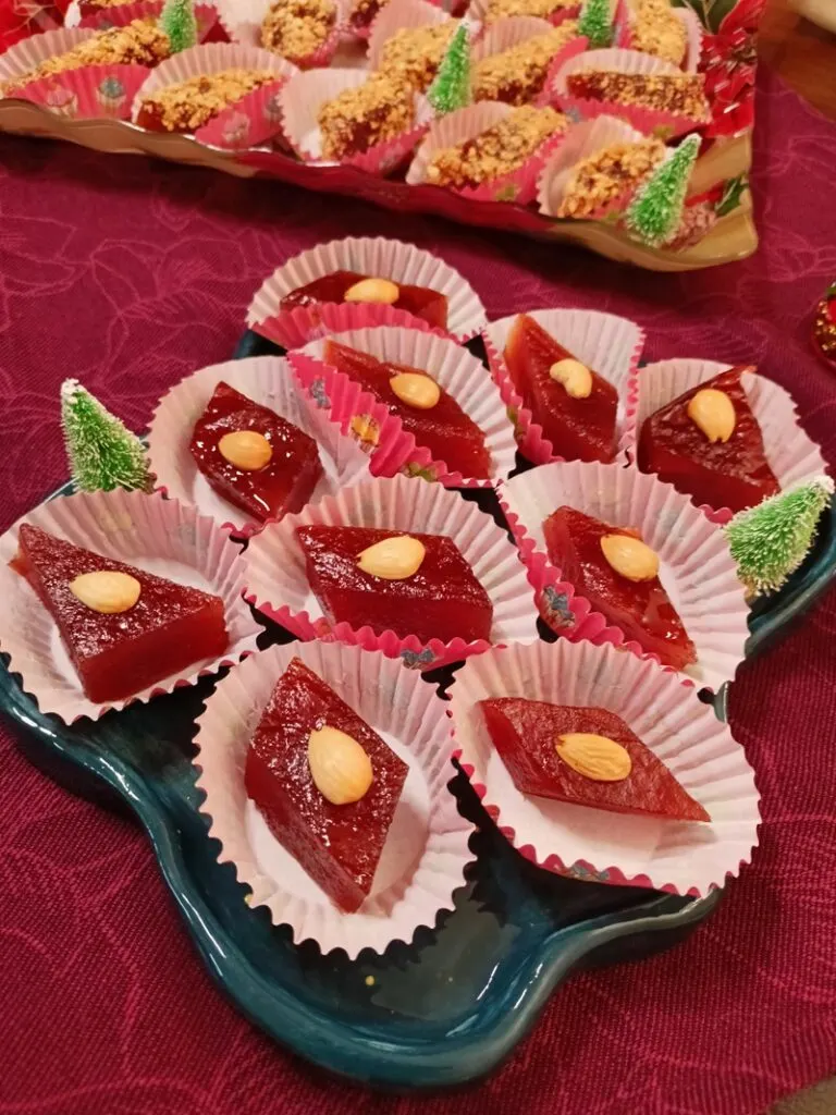 Kydonopasto with a roasted almond on each piece image